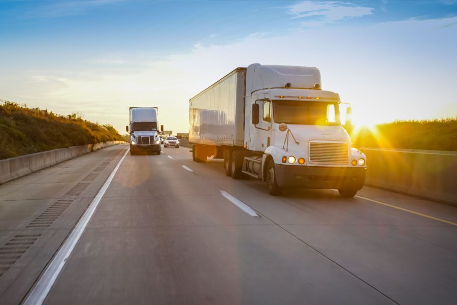 Trucking Insurance - Two Trucks Rolling Down the Highway